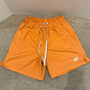 Nike men’s orange shorts. Woven on the inside. Size medium.